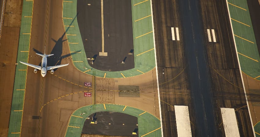 Overhead view of a plane on a runway at San Diego International Airport